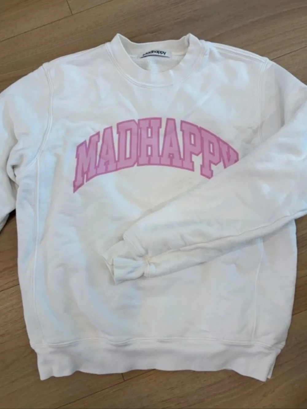 Madhappy White Crewneck Sweatshirt with Pink Logo Arch